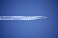 A Jet Plane Leaving A Condensation Trail