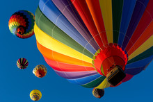 Festival Of Ballooning. Colorful Hot Air Balloon Flying In The Bright Blue Sky.