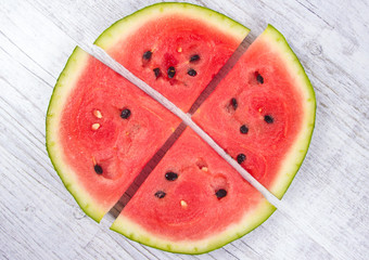 Watermelon on wooden background.