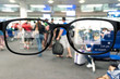 © zapp2photo - Augmented reality marketing and smart AR glasses technology concept. Customer using AR application to monitoring , check , alert  airline flight. Blur Airport background