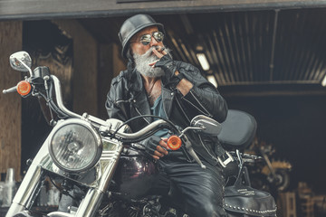 Canvas Print - Relaxed old man on bike waiting for someone