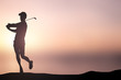© chinnarach - black silhouette golf player man with stance and posture after hit theology ball,sport outdoor concept