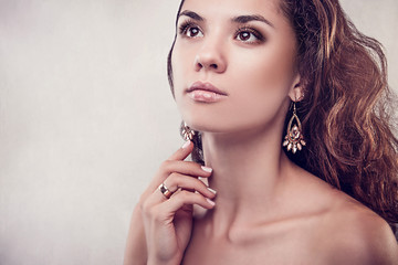 Beautiful woman with curly hair and manicure