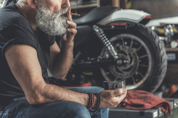 Canvas Print - Old bearded man having some rest near bike