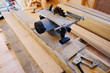© sergeevspb - circular saw in the construction of a wooden house. selective focus