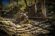 Motocross rider passes through the mud on the hardenduro race