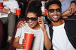 © Drobot Dean - Attractive afro american couple watching 3D movie