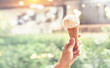 © oatawa - woman hands holding ice cream cones on summer