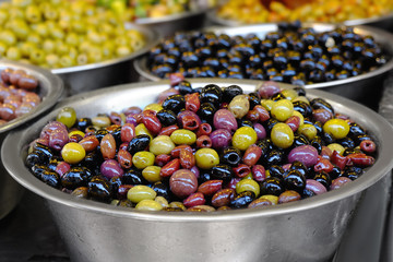 Wall Mural - Different fresh olives in bowl at market