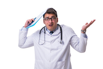 Young male doctor with a writing board isolated on white backgro