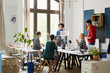 © ALTO IMAGES/Stocksy - Businesswoman giving a presentation to colleague
