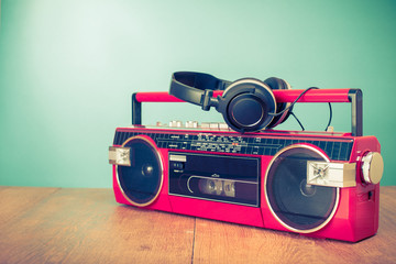 Wall Mural - old retro red stereo radio cassette recorder and headphones