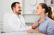 © JackF - Smiling woman patient with male doctor