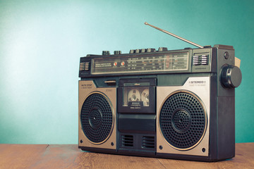 Wall Mural - retro radio recorder from 70s front turquoise background. old instagram style filtered photo