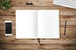 © itim2101 - Top view of blank paper page on wood background office desk and different objects. Minimal flat lay style