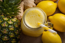 Juicing Raw Fruits And Vegetables And Juice Extractor Recipes Concept With Pineapple, Lemon And Ginger, The Ingredients For A Detox Smoothie That Helps With Inflammation And Digestion