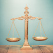 Law scales on table. Symbol of justice. Retro style filtered photo