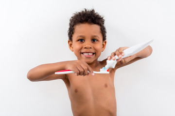 Wall Mural - kid applying tooth paste on brush