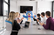 © .shock - boss dresed as bear having fun with business people in trendy office