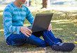 © lkoimages - Happy student study with laptop in city park
