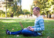 © lkoimages - Happy student study with laptop in city park