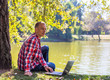 © lkoimages - Happy student study with laptop in city park