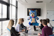 © .shock - boss dresed as bear having fun with business people in trendy office