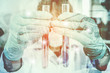 © sawitreelyaon - Double exposure of science experiment  hand holding test tube in the laboratory