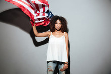 Young Afro American Woman Holding American Flag