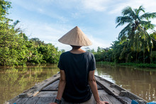 Woman With Traditional Vietnamese Hat Sailing The Mekong River