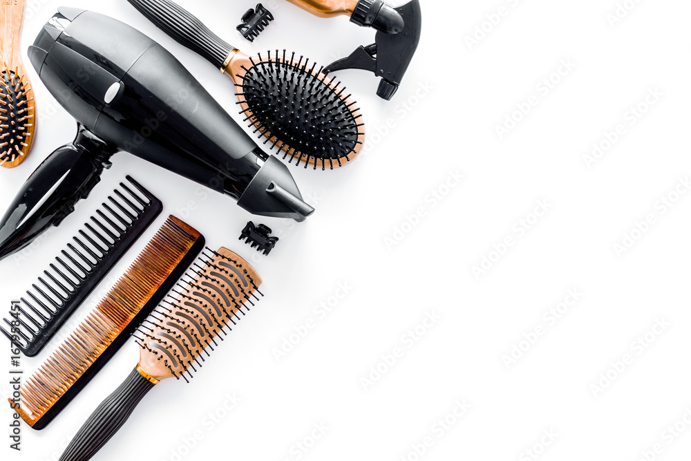Combs and hairdresser tools in beauty salon on white background top view copyspace - obrazy, fototapety, plakaty 