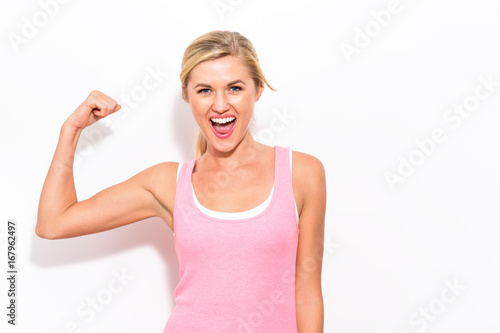 Cuadros en Lienzo Powerful young fit woman on a white background