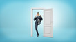 © gearstd - A young businessman stands in a small cut out doorframe and kicks a door open with his foot.