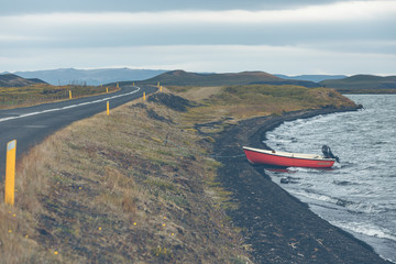 Wall Mural - Iceland Landscape with a Red Boat