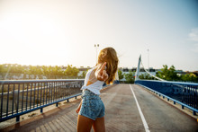 Cheerful Woman Posing On Bridge