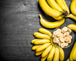 © Artem Shadrin - Ripe bananas with pieces of sliced bananas in a bowl .