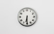 © Peter - White Clock hanging on a white wall showing time 6:30