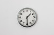 © Peter - White Clock hanging on a white wall showing time 1:30
