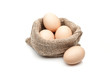 © photo-nuke - chicken eggs in burlap sack isolated on white background