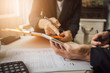 © Phushutter - Discussion and cooperation between employees and company presidents in International Oil Trade Organizations with business contract documents and borrowing money from a government bank.
