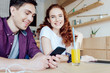 © LIGHTFIELD STUDIOS - young couple using smartphone