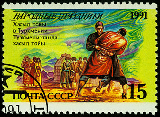 Wall Mural - Khasyl toiy folk festival in Turkmenistan on postage stamp