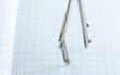 © Vincent - Drafting Compass on paper background