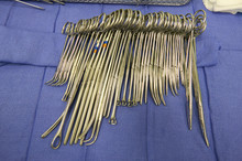 Close Up Of Surgeons Stitching Tools And Scissors