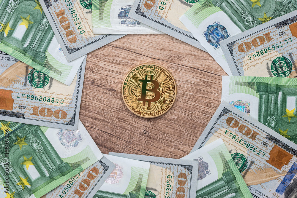 gold bitcoin with euro and dollar bills