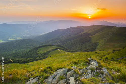 Plakat Zachód słońca w górach