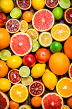 Citrus Background. Fresh Citrus Fruits - Lemons, Oranges, Limes, Grapefruits.