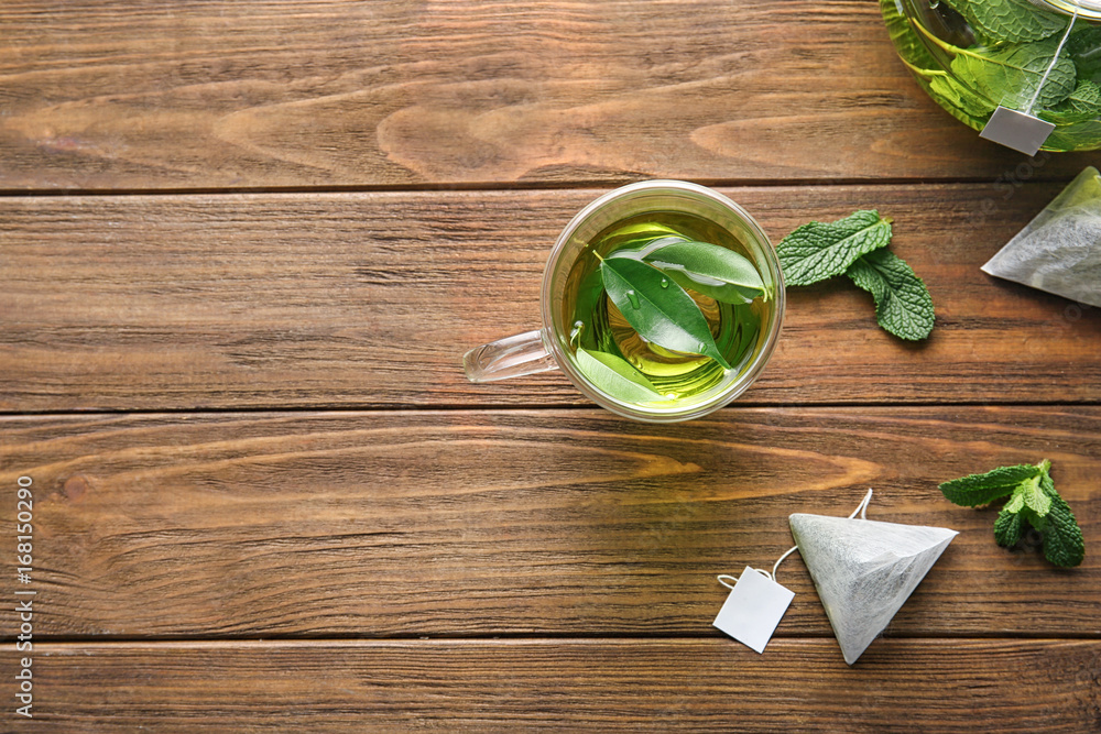 Composition with herbal tea on wooden table. Weight loss concept