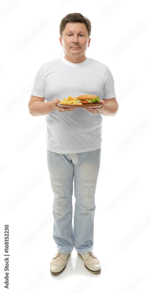 Overweight man holding plate with junk food on white background. Weight loss concept