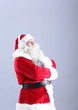 © Africa Studio - Santa Claus listening to music on color background